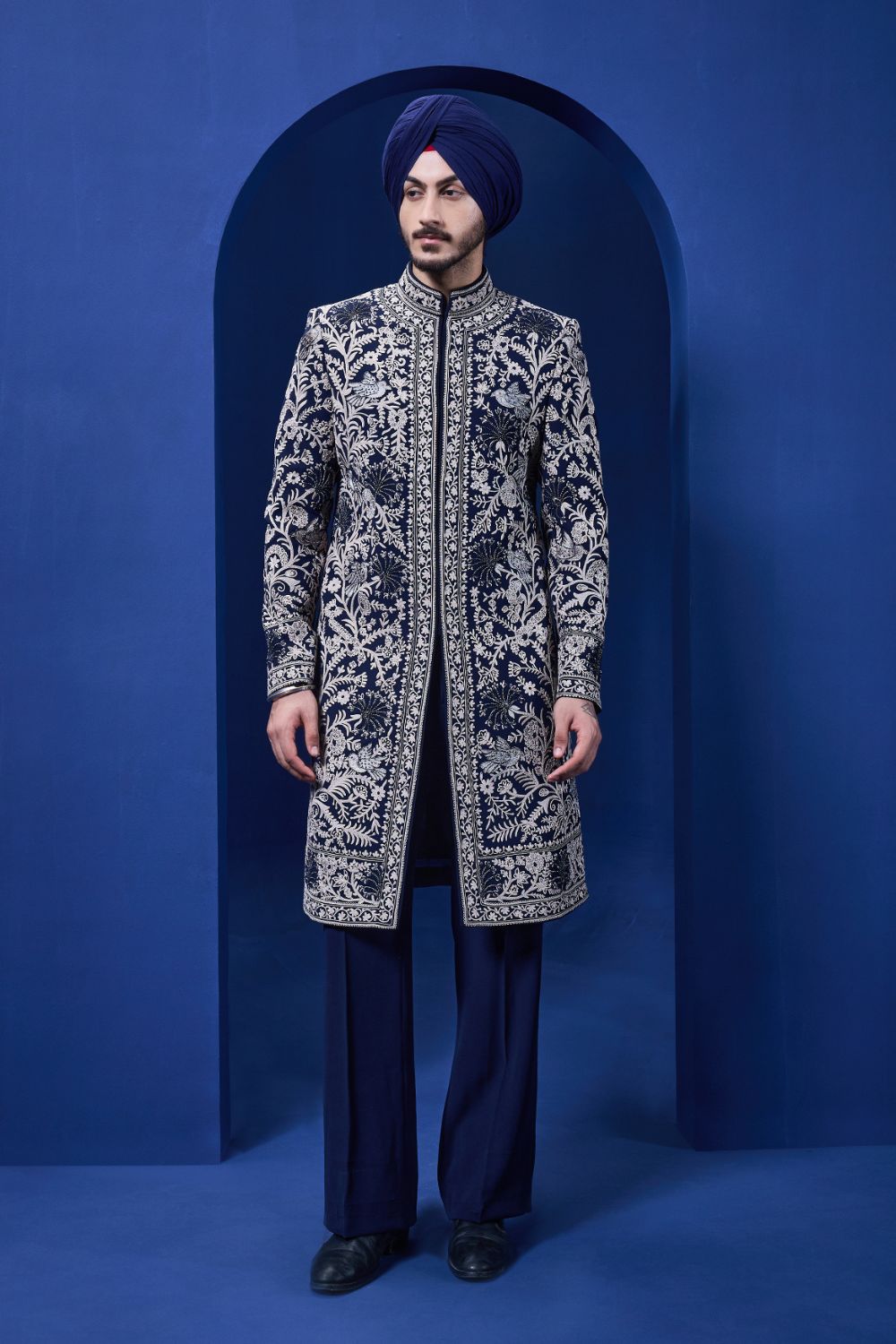 Navy blue Indo Western highlighted with sequins, pearls and thread work