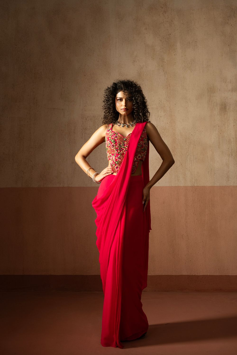 Predraped , fuschia pink , embroidered georgette saree with corset blouse
