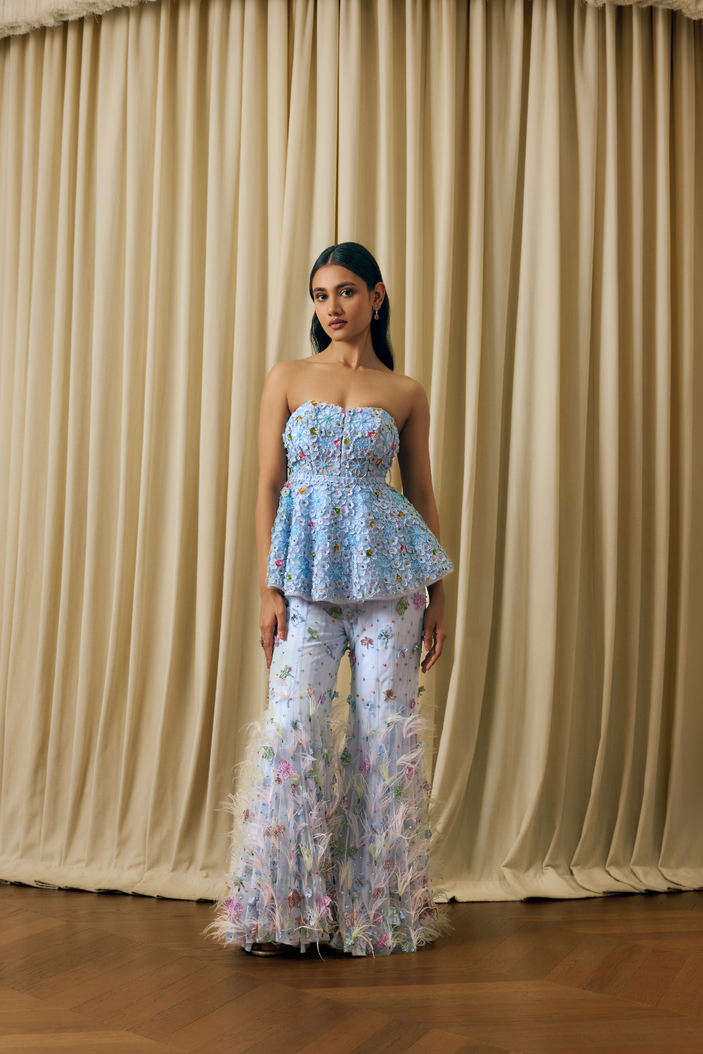 Peplum corset with 3d elements and feathers sharara
