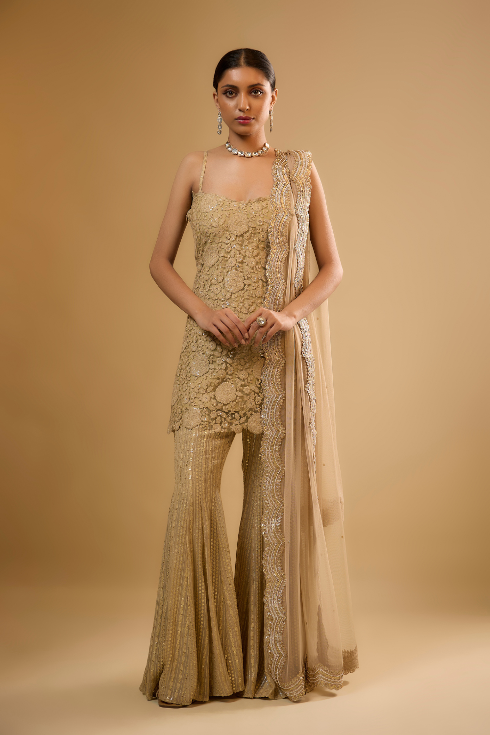 Gold net kurta sharara set embroidered with sequin and threadwork