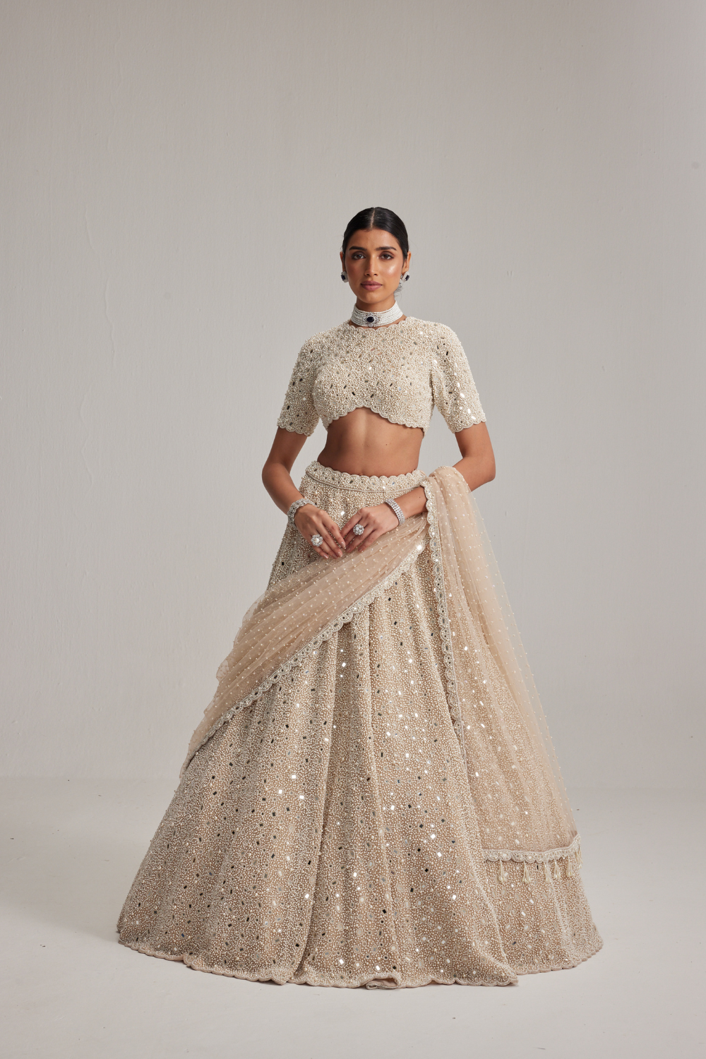 Light Beige Dense mirror and pearl lehenga set with High neck Blouse and Dupatta