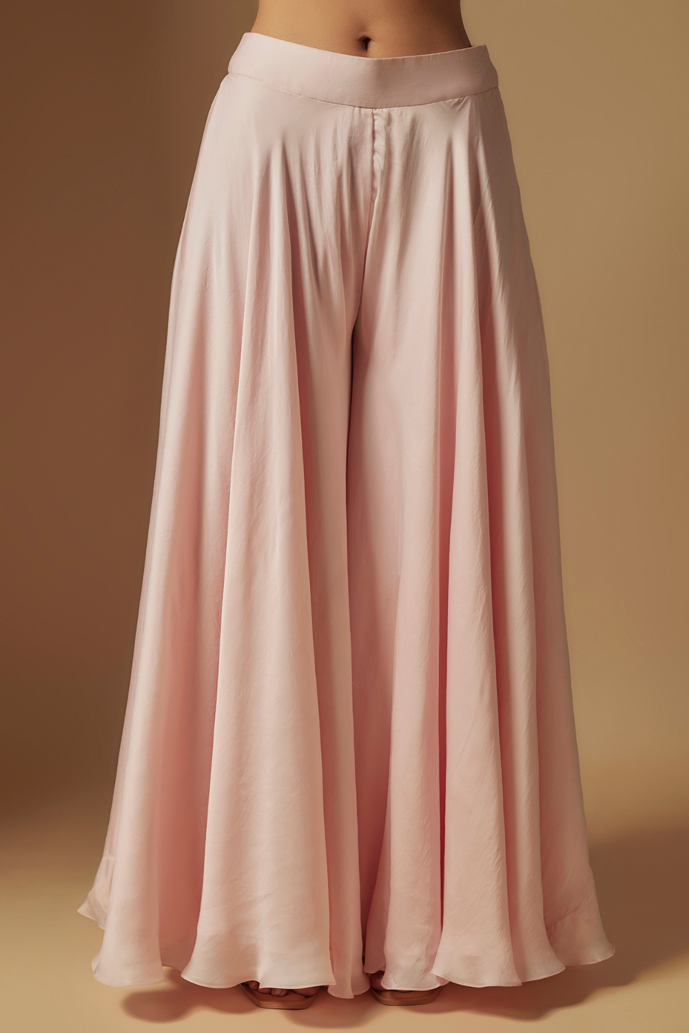 Noom Hand  embroidered  short kurti  paired  with sharara and dupatta