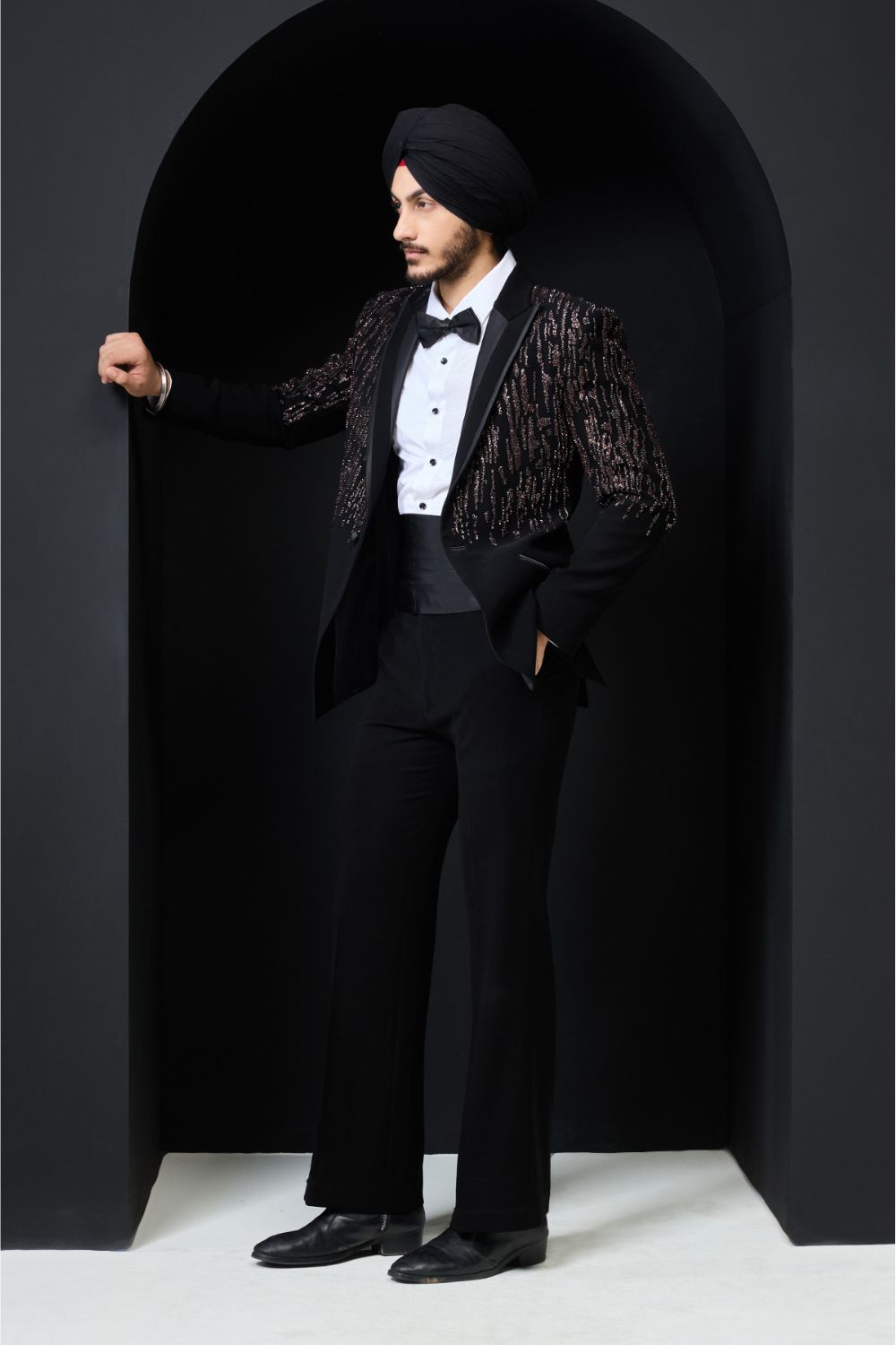 Black tuxedo highlighted with pearls, sequins and thread work