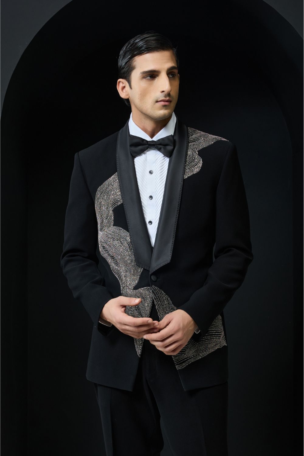 Black tuxedo highlighted with silver zari , cutdana and peals