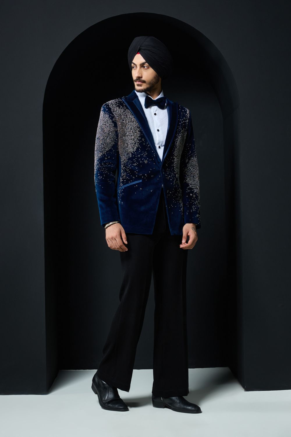 Teal blue tuxedo highlighted with sequins, pearls and cutdana