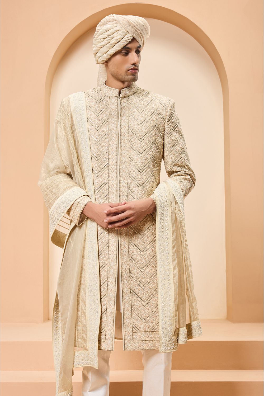 Ivory gold sherwani detailing with zardozi,pearl,sequins and thread work