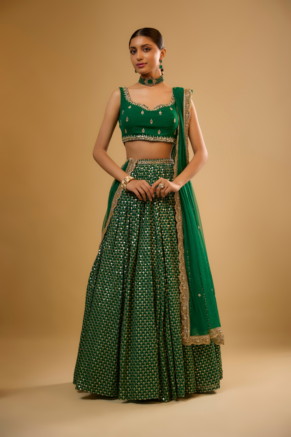 Emerald green georgette lehenga set embroidered with mirrors and gold sequins