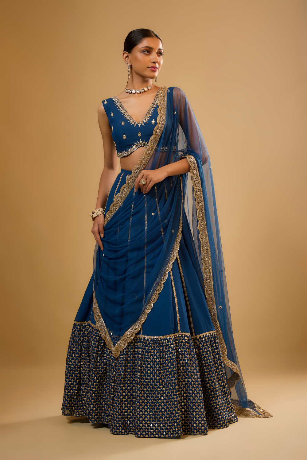 Egyptian blue georgette lehenga set embroidered with mirrors and gold sequins