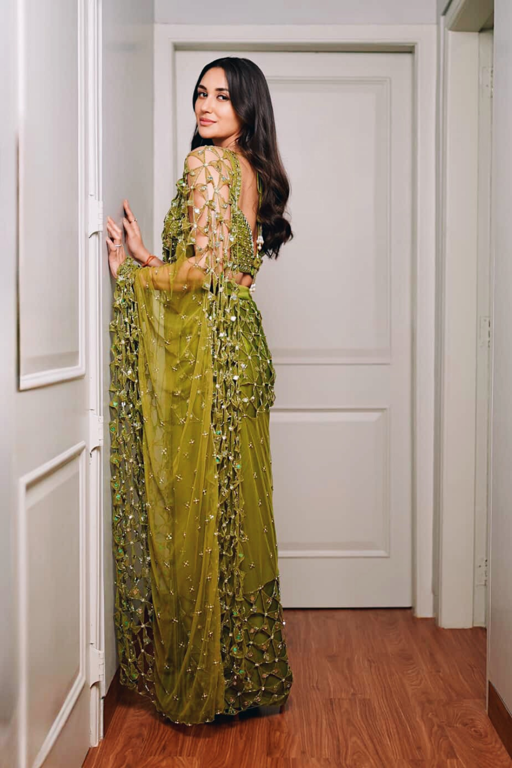 Predraped , mehendi green , hand embroidered net & satin saree
