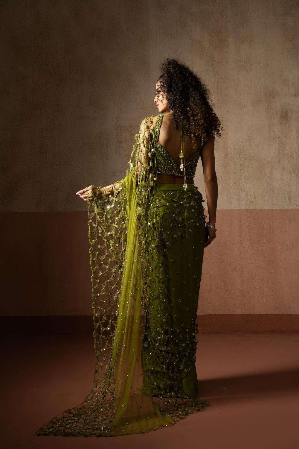 Predraped , mehendi green , hand embroidered net & satin saree