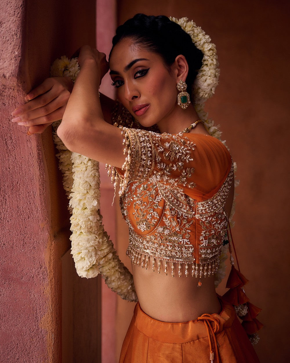 Rust orange embroidered blouse, shimmer tissue lehenga and dupatta