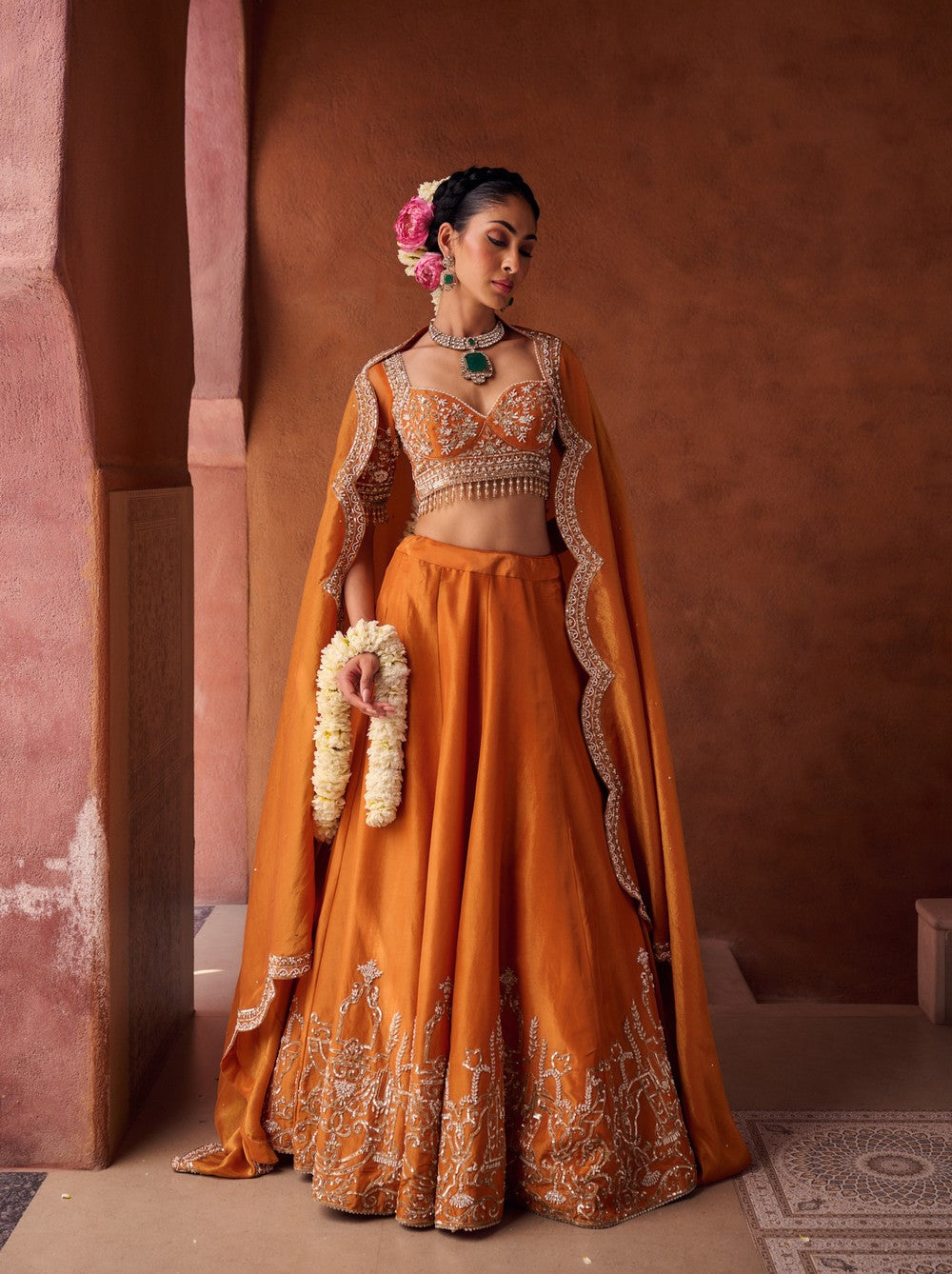 Rust orange embroidered blouse, shimmer tissue lehenga and dupatta