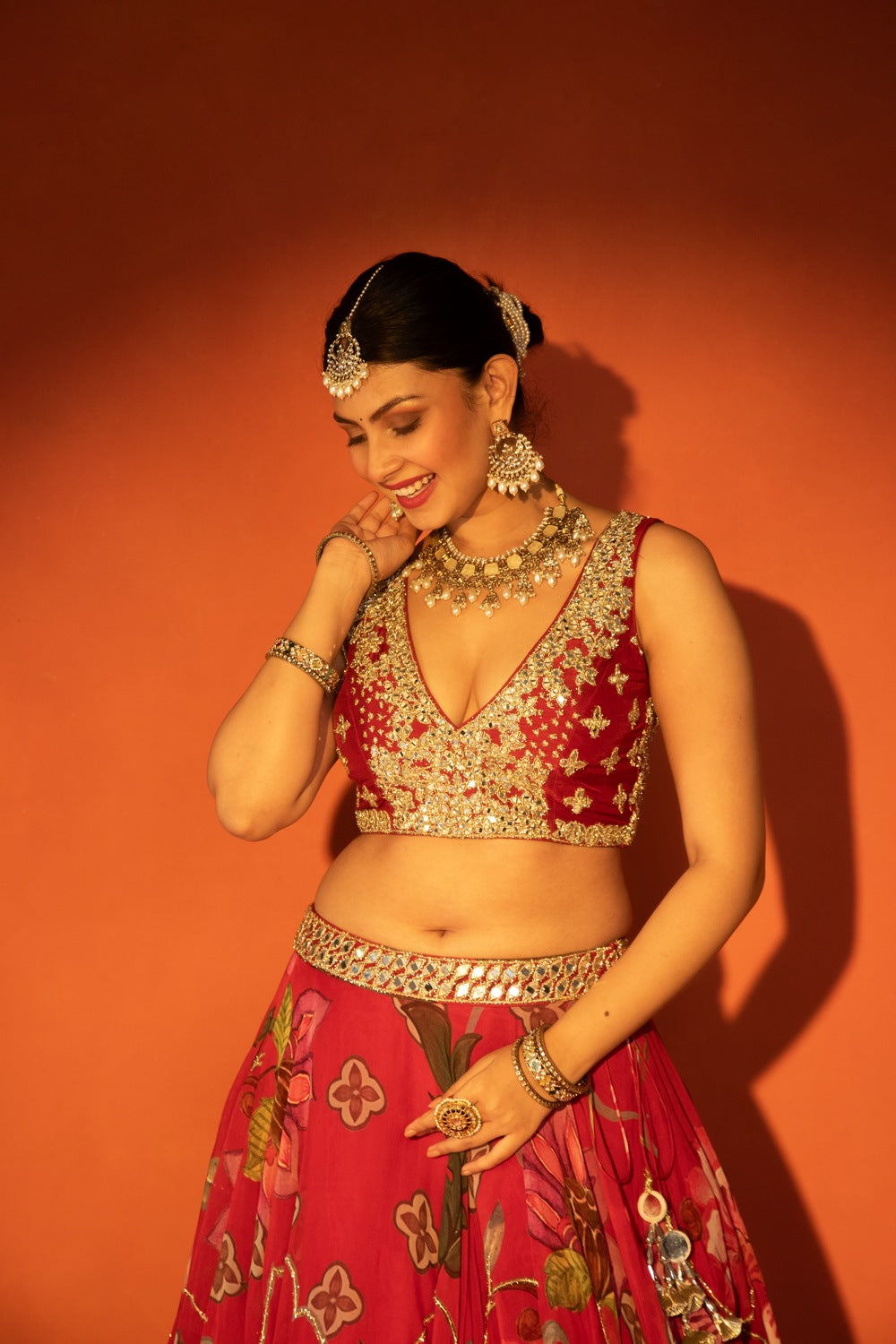 Red floral lehenga with mirror-work blouse and placement dupatta