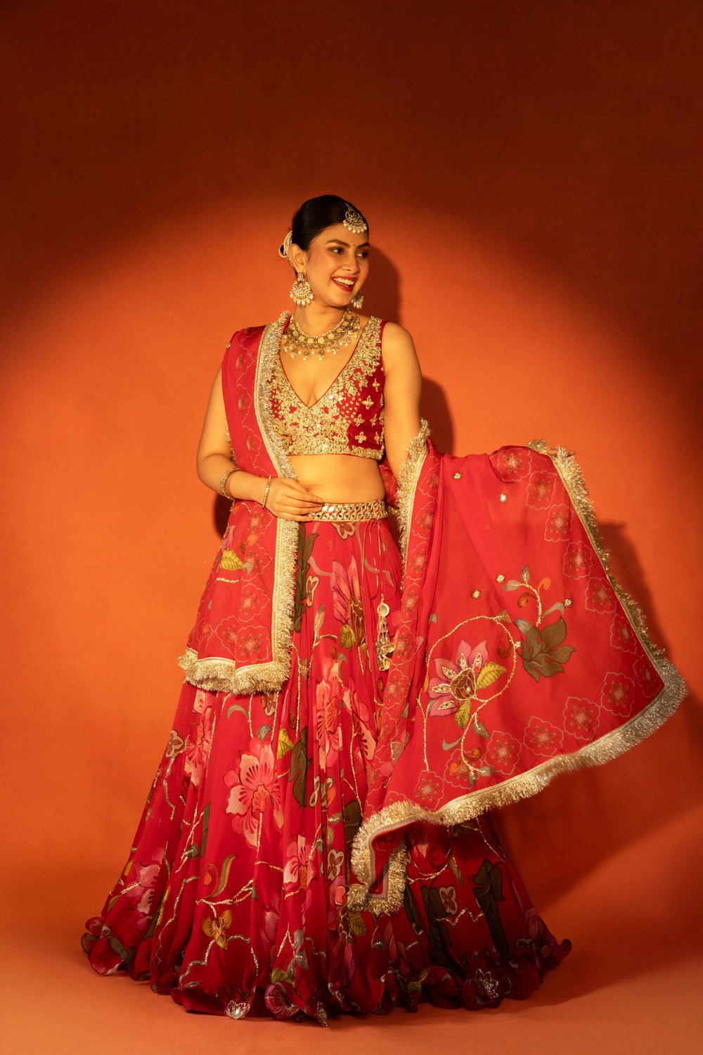 Red floral lehenga with mirror-work blouse and placement dupatta