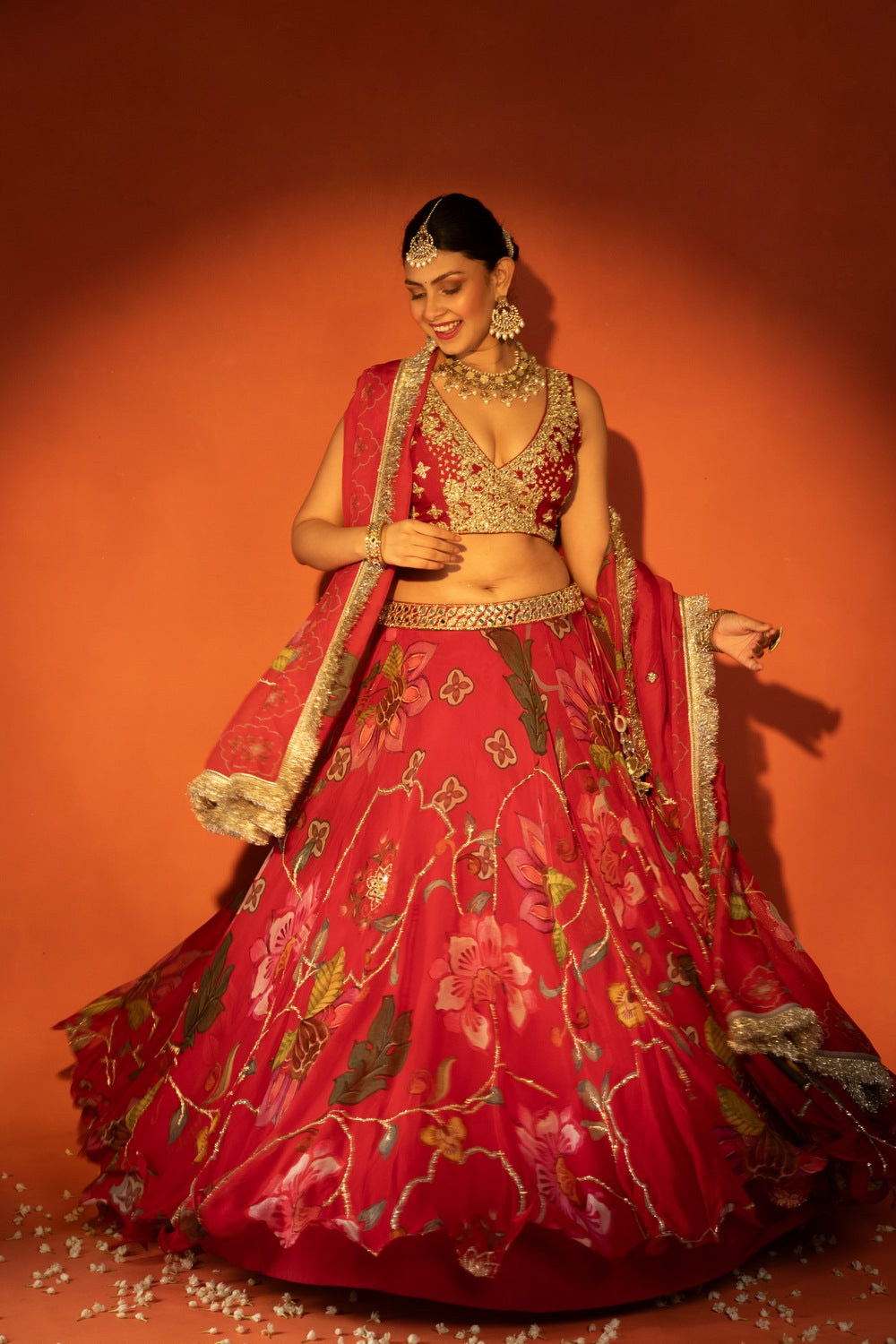 Red floral lehenga with mirror-work blouse and placement dupatta