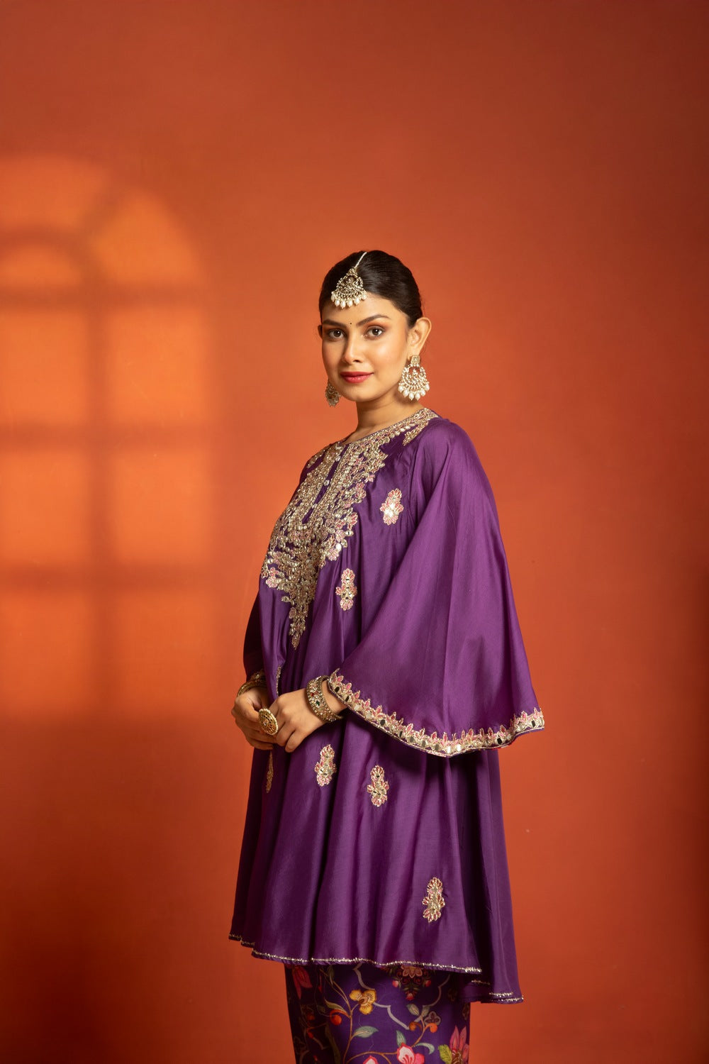 Purple Short Semi- Anarkali with a heavily Embroidered Neckline, Paired with Floral Printed Salwar Pants & Dupatta