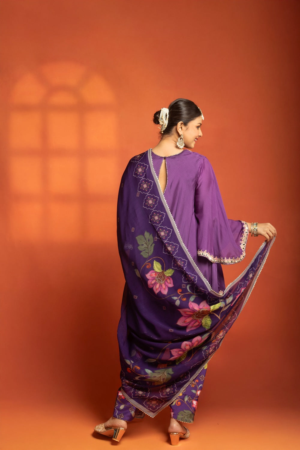 Purple Short Semi- Anarkali with a heavily Embroidered Neckline, Paired with Floral Printed Salwar Pants & Dupatta